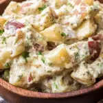 ultimate potato salad recipe in bowl with bacon