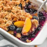 Peach blueberry crisp in baking dish