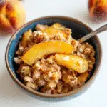 Peach crisp with golden oat topping
