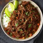 Mexican shredded beef with lime and tortillas