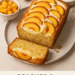Peaches & Cream Cheese Loaf sliced on a wooden board