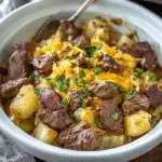 Slow Cooker Steak and Cheddar Potato Casserole in a slow cooker