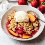 “Strawberry peach crumble in baking dish