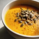 Butternut squash soup with maple and pepitas